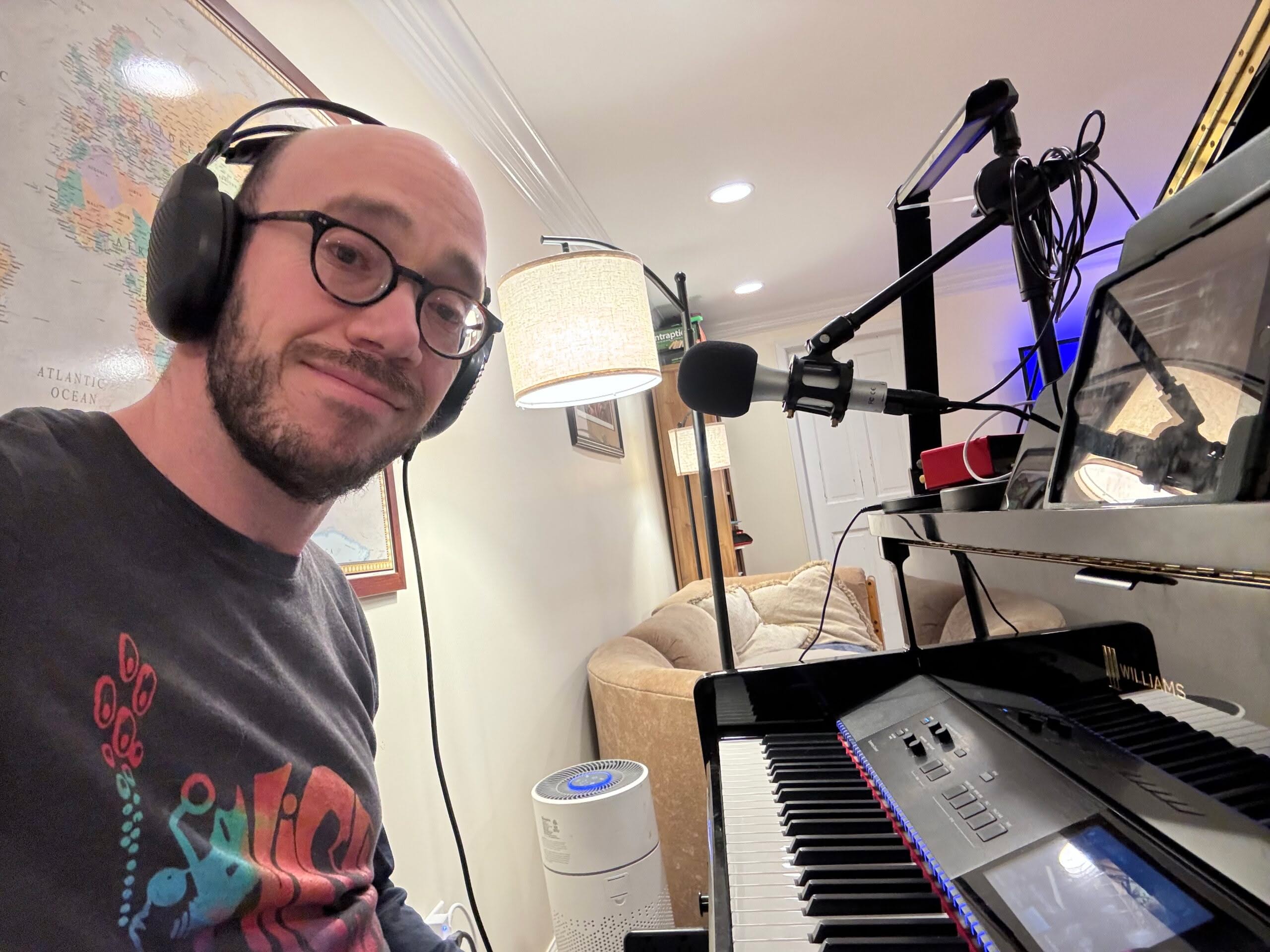 IMG_2245 Man wearing headphones at home piano studio setup